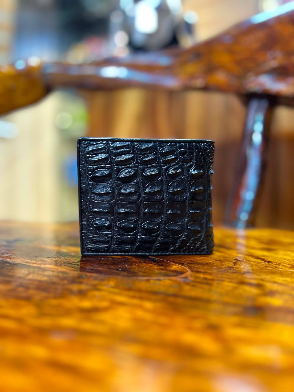 Black crocodile hornback bifold wallet, front