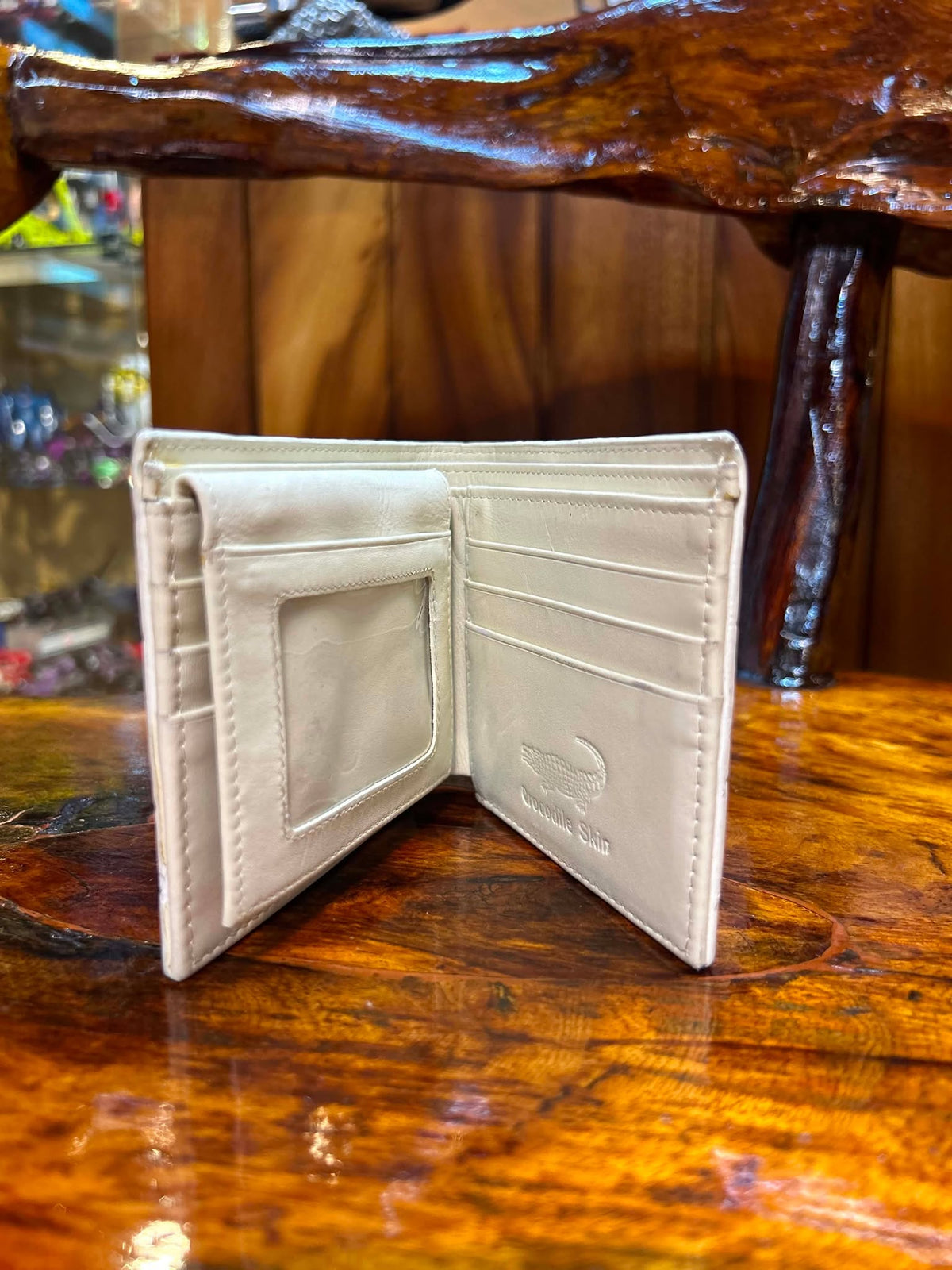 Cream crocodile wallet open, showing ID window and card slots
