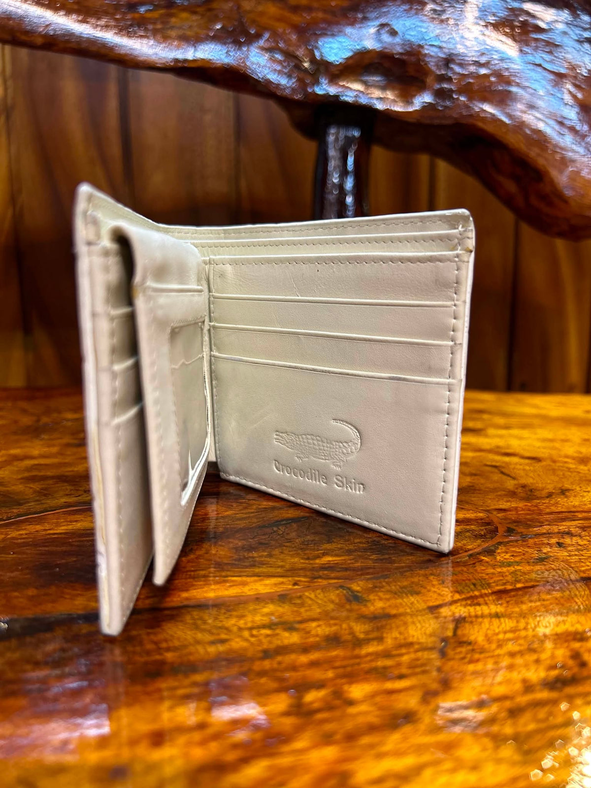 Cream crocodile wallet open, angled view of interior