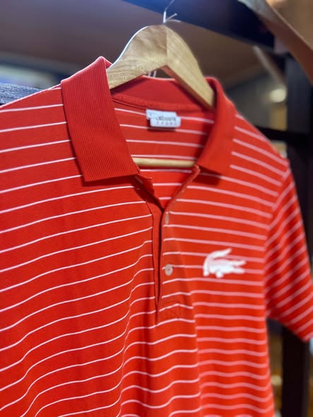 Lacoste Sport red striped polo, angled front view