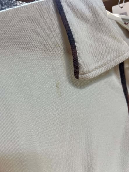 Close-up of spot on Original Penguin polo